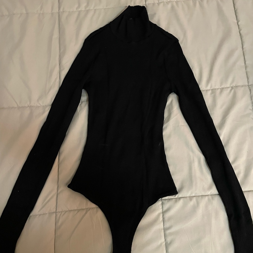 Lulu’s small, black, ribbed turtleneck bodysuit.